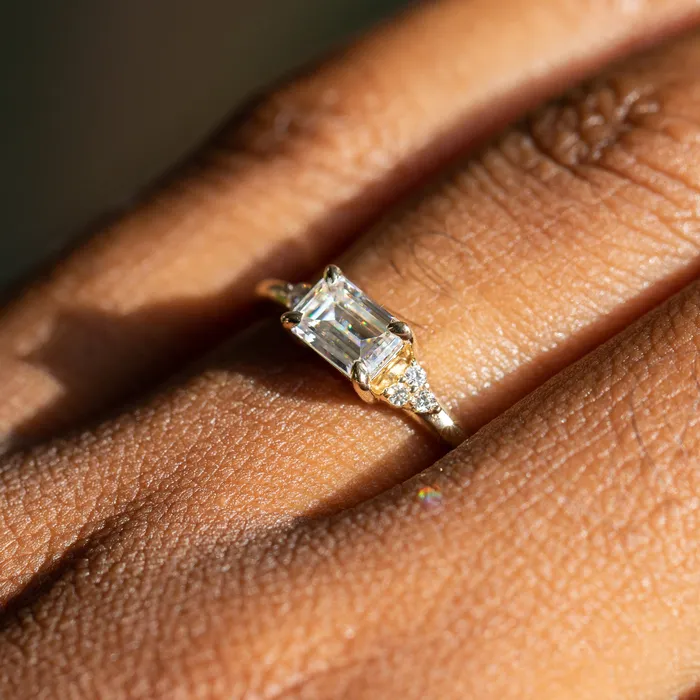 Rings Anueva Jewelry EastWest Emerald cut Moissanite Asymmetrical Ring in 14k Yellow Gold