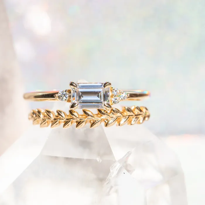 Rings Anueva Jewelry EastWest Emerald cut Moissanite Asymmetrical Ring in 14k Yellow Gold