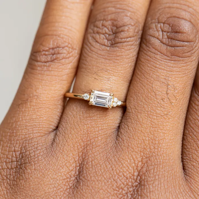 Rings Anueva Jewelry EastWest Emerald cut Moissanite Asymmetrical Ring in 14k Yellow Gold
