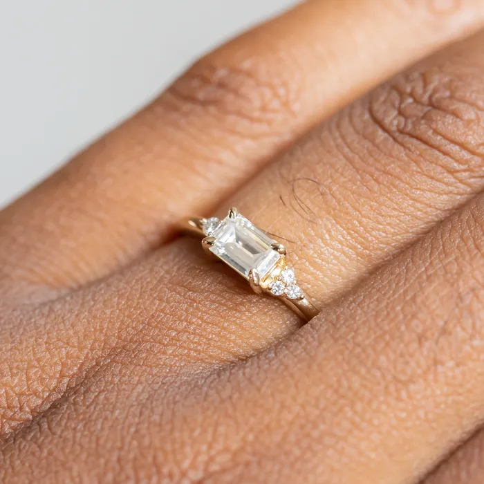 Rings Anueva Jewelry EastWest Emerald cut Moissanite Asymmetrical Ring in 14k Yellow Gold
