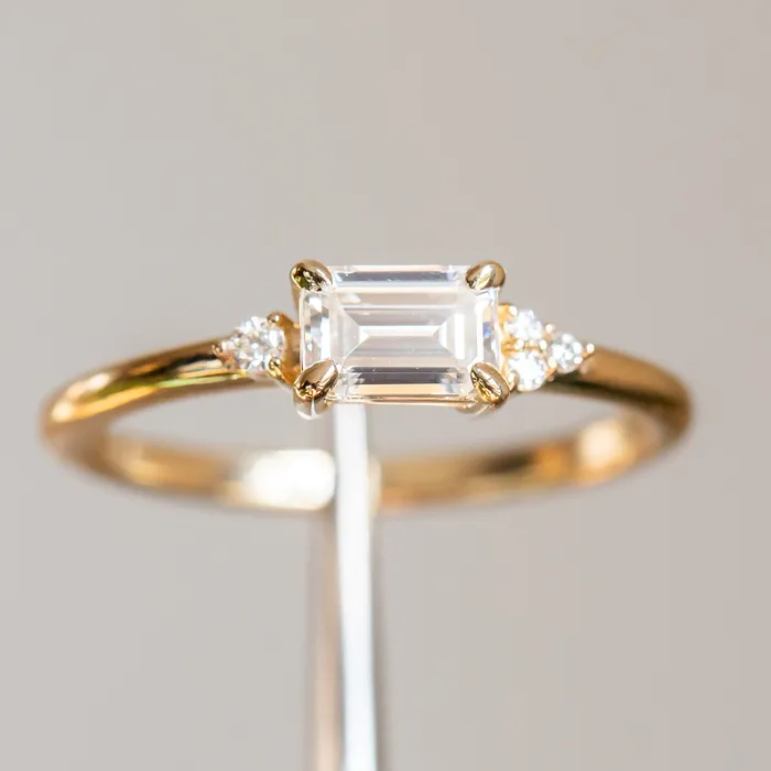 Rings Anueva Jewelry EastWest Emerald cut Moissanite Asymmetrical Ring in 14k Yellow Gold