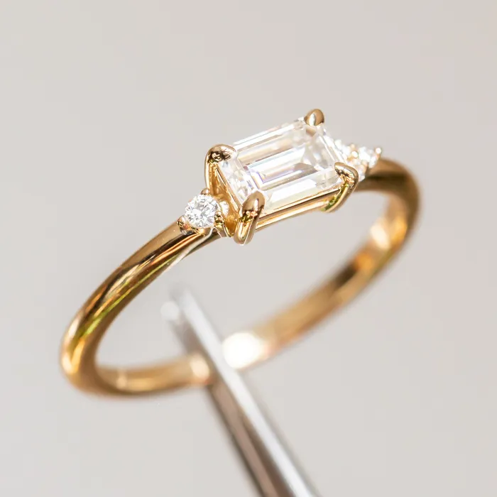 Rings Anueva Jewelry EastWest Emerald cut Moissanite Asymmetrical Ring in 14k Yellow Gold