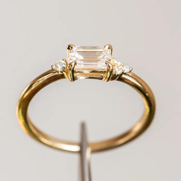 Rings Anueva Jewelry EastWest Emerald cut Moissanite Asymmetrical Ring in 14k Yellow Gold