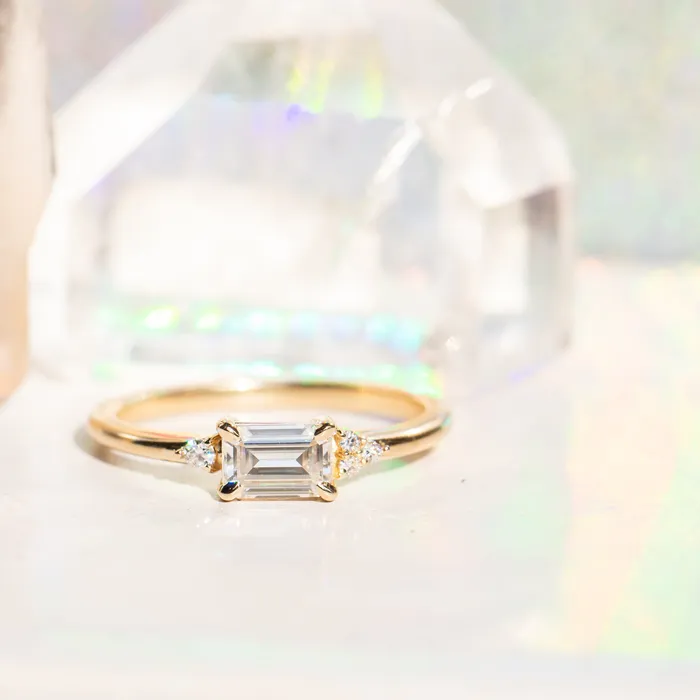 Rings Anueva Jewelry EastWest Emerald cut Moissanite Asymmetrical Ring in 14k Yellow Gold