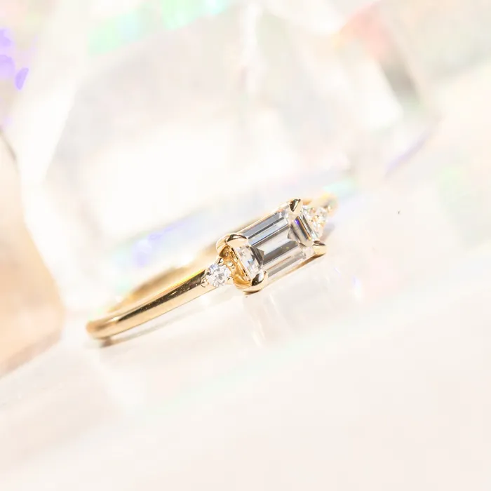 Rings Anueva Jewelry EastWest Emerald cut Moissanite Asymmetrical Ring in 14k Yellow Gold